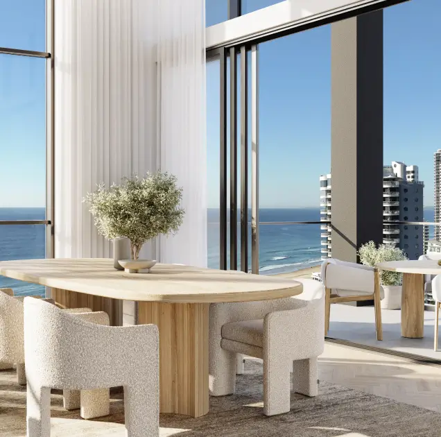 A stylish dining space featuring modern furniture, large windows showcasing a stunning ocean view, and a bright, airy atmosphere ideal for luxurious living.