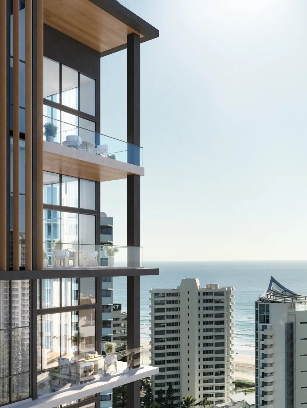 Close-up view of a modern high-rise building with glass balconies, sleek lines, and wooden accents, overlooking the ocean and city skyline.